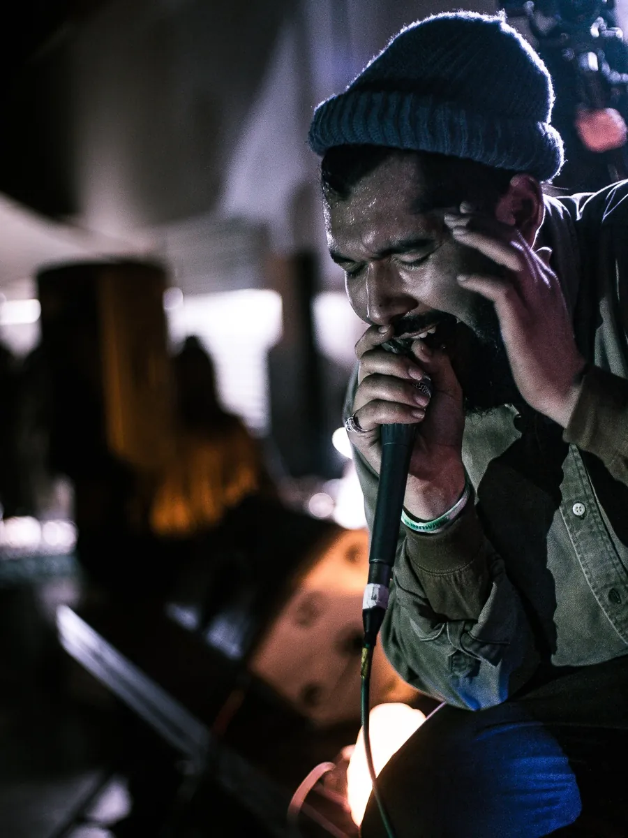 A crew member on a walkie during a night shoot