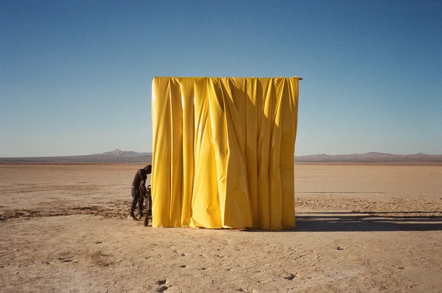 The yellow curtain going up in the desert for Lyrical Lemonade's All Is Yellow series