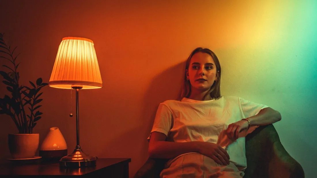 Behind the scenes in an amber-lit room mid-production